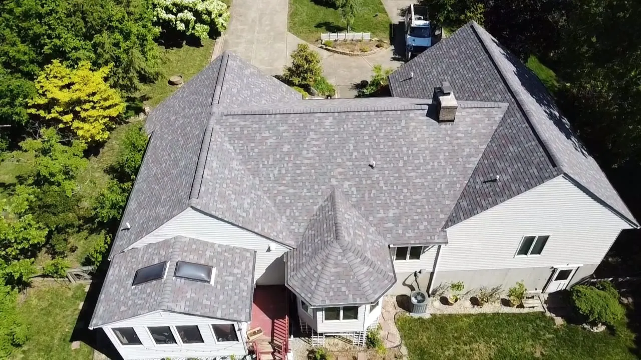 Aerial view of a large finished gray shingle roof